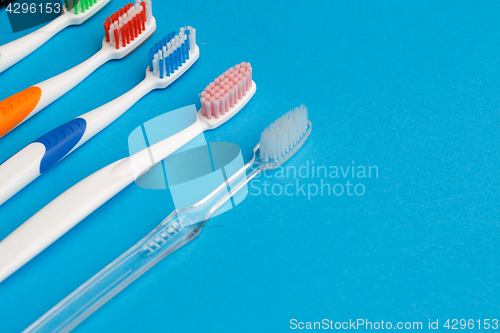 Image of Colored toothbrushes , place for inscription