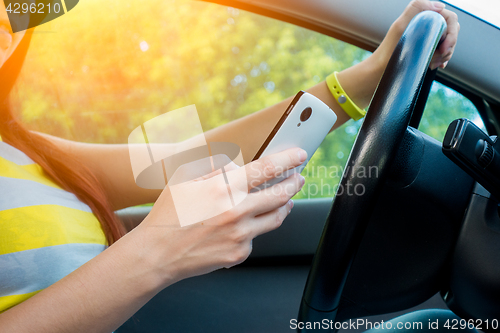 Image of Photo of girl with phone