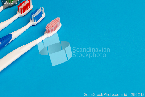 Image of Image of several multi-colored toothbrushes