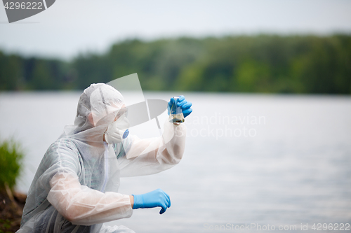 Image of One ecologist with test tube