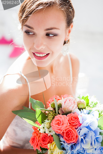 Image of Beautiful bride in wedding dress, white background