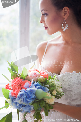 Image of Beautiful bride in wedding dress, white background