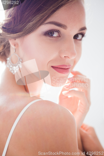 Image of Beautiful bride in wedding dress, white background