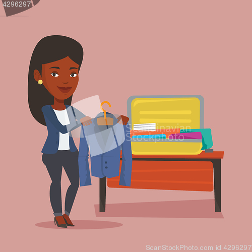 Image of Woman packing her suitcase vector illustration.