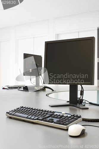 Image of Two computers in an office