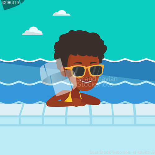 Image of Smiling young woman in swimming pool.