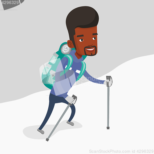 Image of Young mountaneer climbing a snowy ridge.