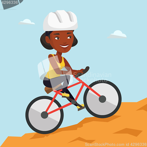 Image of Young woman on bicycle traveling in the mountains.