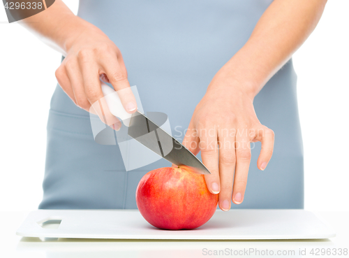 Image of Cook is chopping apple