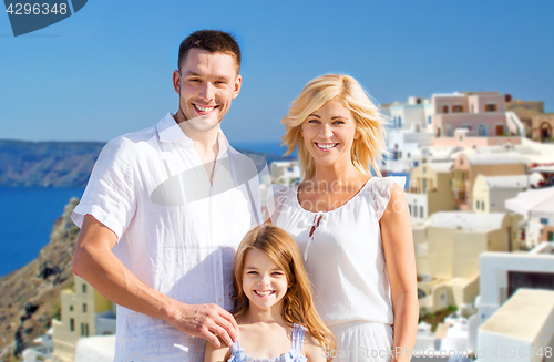 Image of happy family over santorini island background