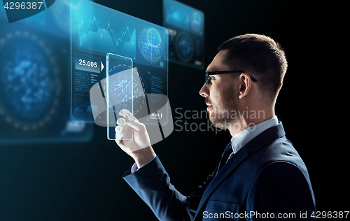 Image of businessman with tablet pc and virtual screens