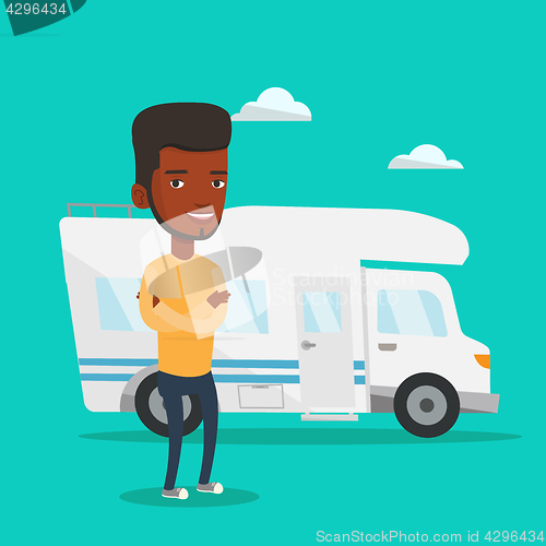 Image of Man standing in front of motor home.