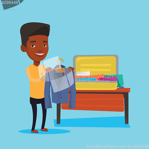 Image of Man packing his suitcase vector illustration.
