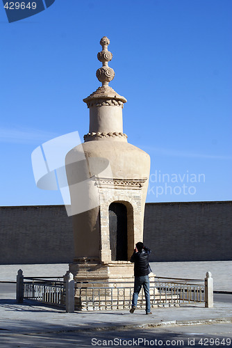 Image of Stupa and man