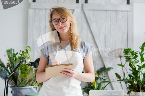 Image of Portrait of young girl florist