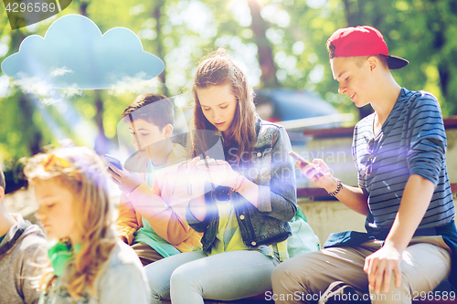 Image of happy teenage friends with smartphones outdoors