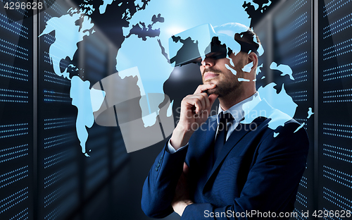 Image of man in virtual reality headset with world map