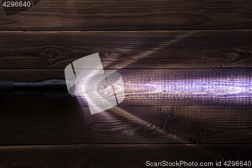 Image of Wooden background with glowing lantern