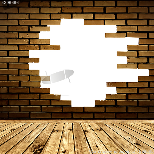 Image of broken brick wall in the room