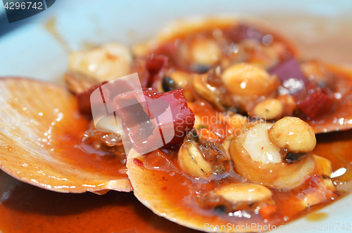 Image of Scallop in its shell cook with chili