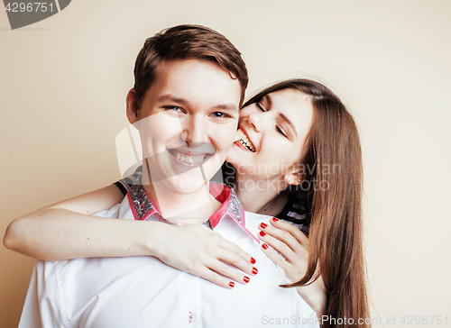 Image of young pretty teenage couple, hipster guy with his girlfriend hap