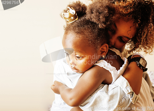 Image of adorable sweet young afro-american mother with cute little daugh