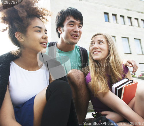 Image of cute group teenages at the building of university