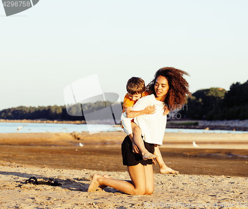 Image of pretty diverse nation and age friends on sea coast having fun, lifestyle people concept on beach vacations close up