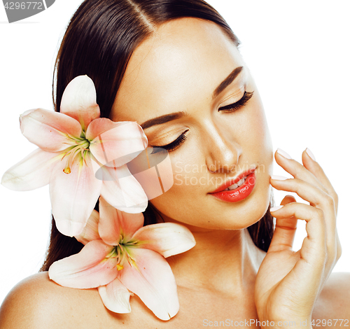 Image of young attractive lady closeup with hands on face isolated flower