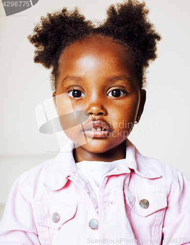 Image of little cute african american girl playing with animal toys at ho