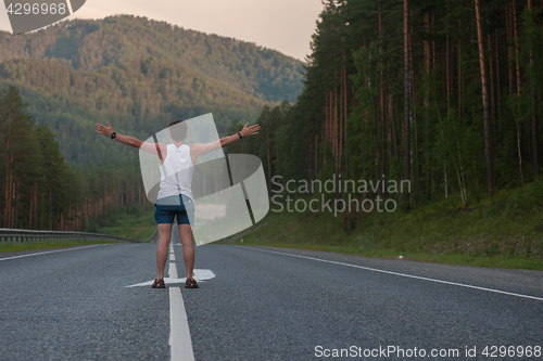 Image of Man laying on the road