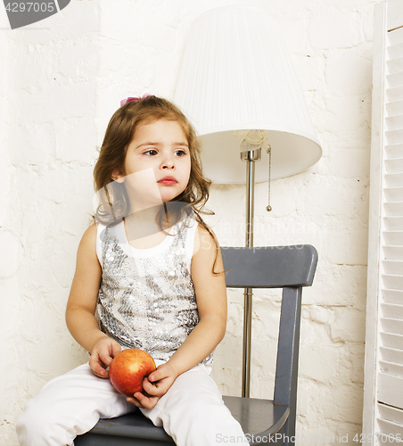 Image of little cute brunette girl at home interior happy smiling close up, lifestyle real people concept