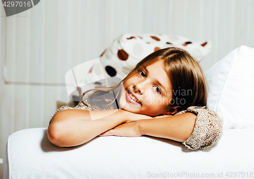 Image of little cute brunette girl at home interior happy smiling close up, lifestyle real people concept