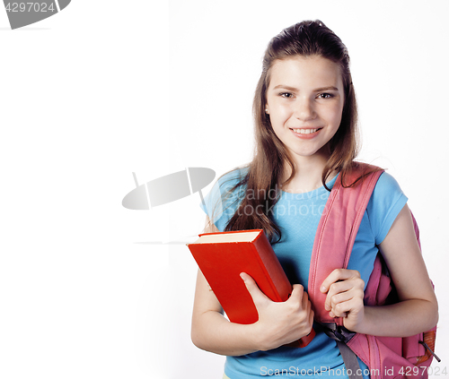 Image of young cute teenage girl posing cheerful against white background with books and backpack isolated