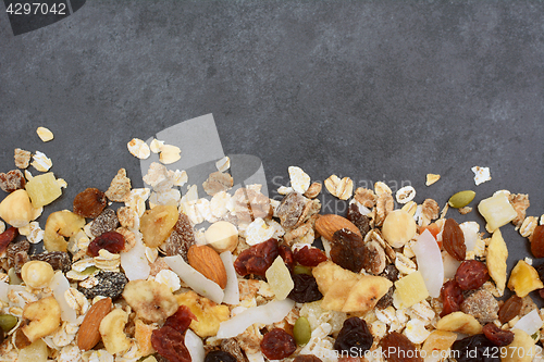 Image of Muesli line on dark grey slate tile background