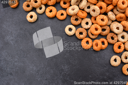 Image of Multigrain hoops breakfast cereal diagonal border on grey slate