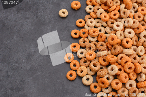 Image of Multigrain hoops breakfast cereal on grey slate background