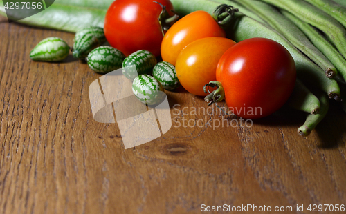 Image of Cucamelons with red and orange tomatoes and runner beans