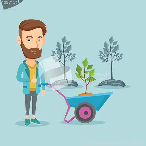 Image of Man pushing wheelbarrow with plant.