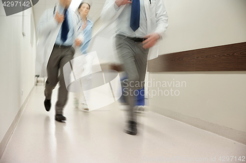 Image of close up of medics or doctors running at hospital