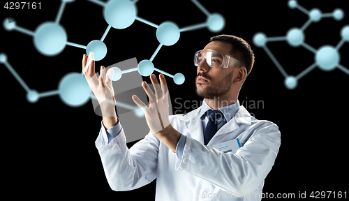 Image of scientist in lab coat and goggles with molecules