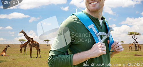 Image of close up of happy man with backpack traveling