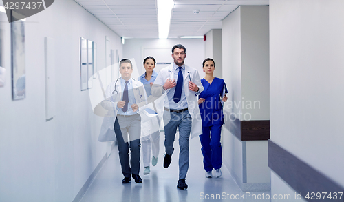 Image of group of medics walking along hospital