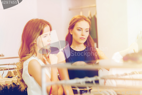 Image of women with shopping bags at clothing shop