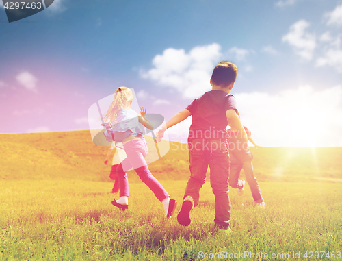 Image of group of happy kids running outdoors