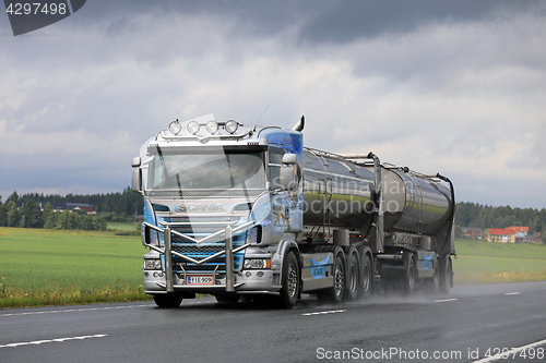 Image of Customized Scania Tank Truck Trucking in Rain