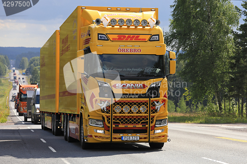 Image of Yellow Next Generation Scania S580 in Truck Convoy