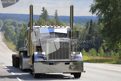 Image of Silver Peterbilt 359 S Trucking on Scenic Highway