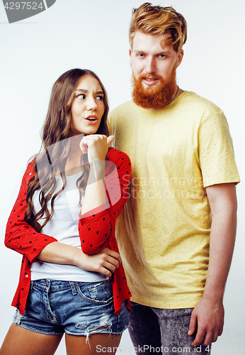 Image of young pretty teenage couple, hipster guy with his girlfriend happy smiling and hugging isolated on white background, lifestyle people concept