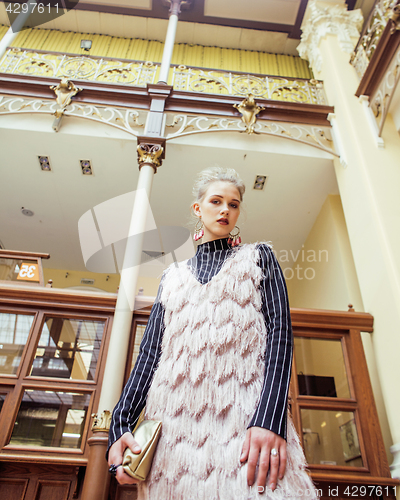 Image of young attractive fashion lady on railway station waiting, vintag